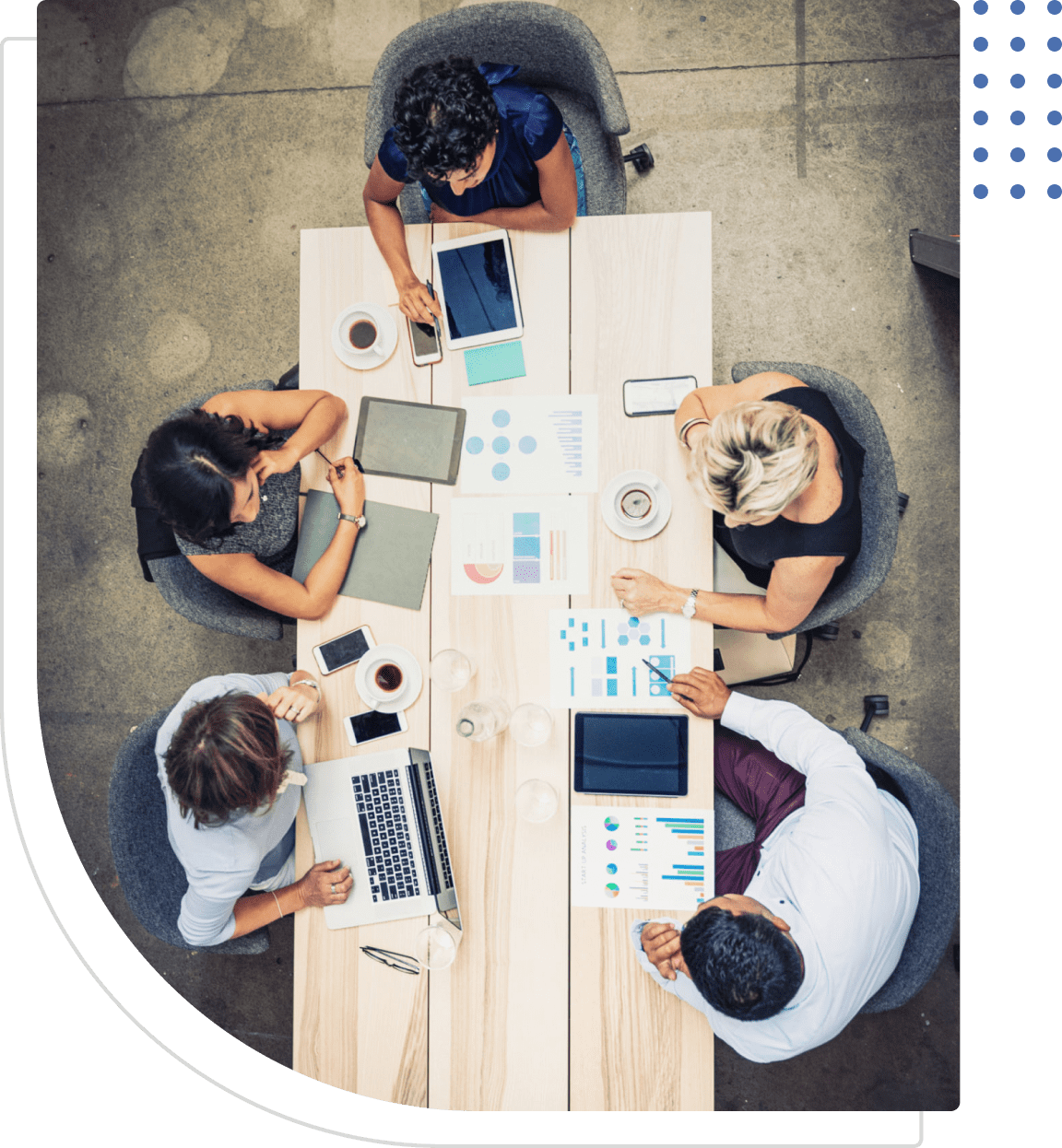 Team meeting with laptops and tablets